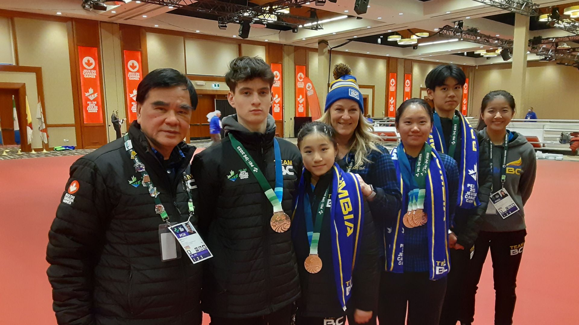 Table Tennis team poses with medals at 2023 Canada Winter Games.