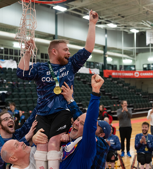 Joel Ewert celebrates after winning gold in wheelchair basketball