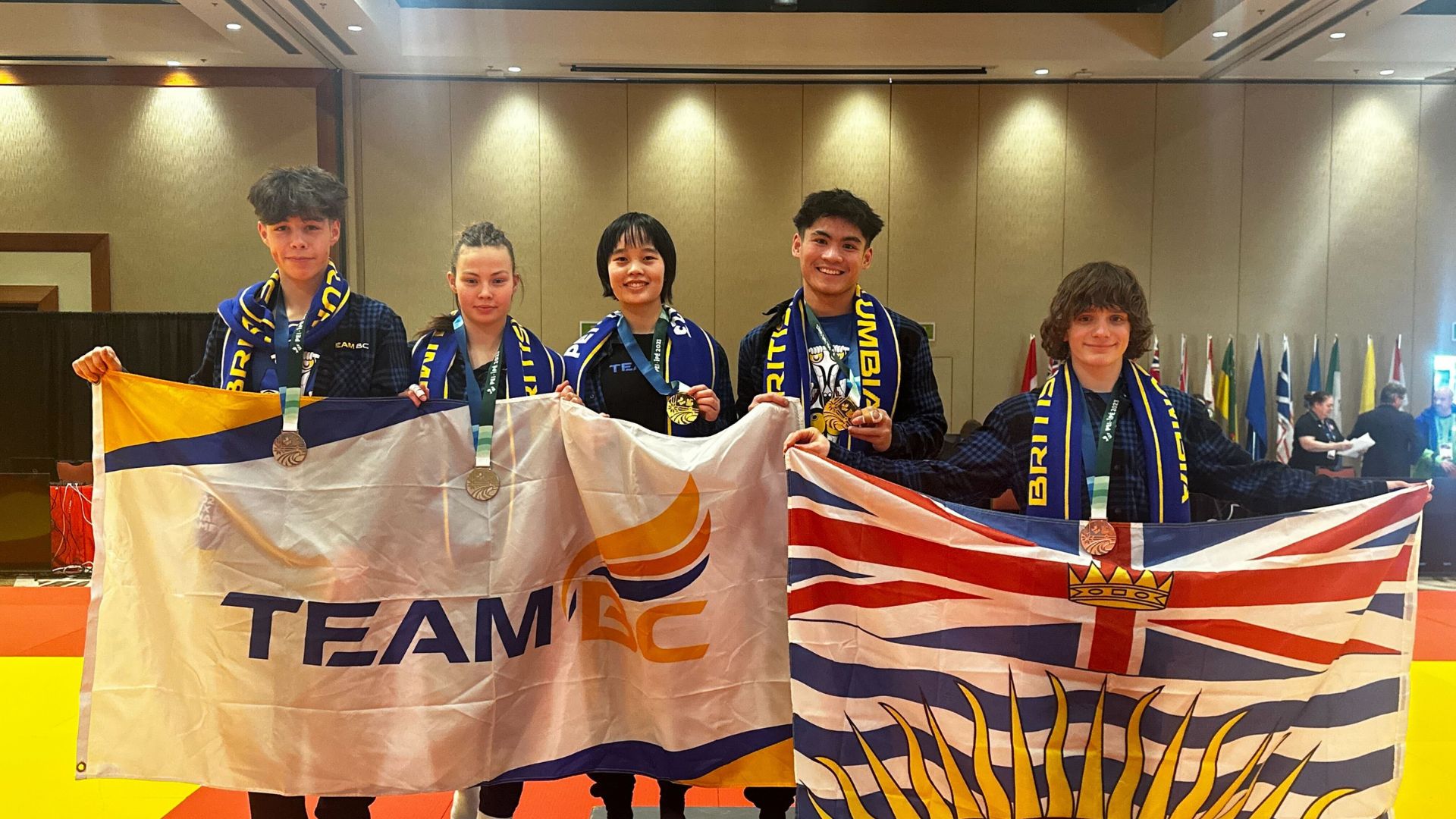 Judo team poses with medals at the 2023 Canada Winter Games