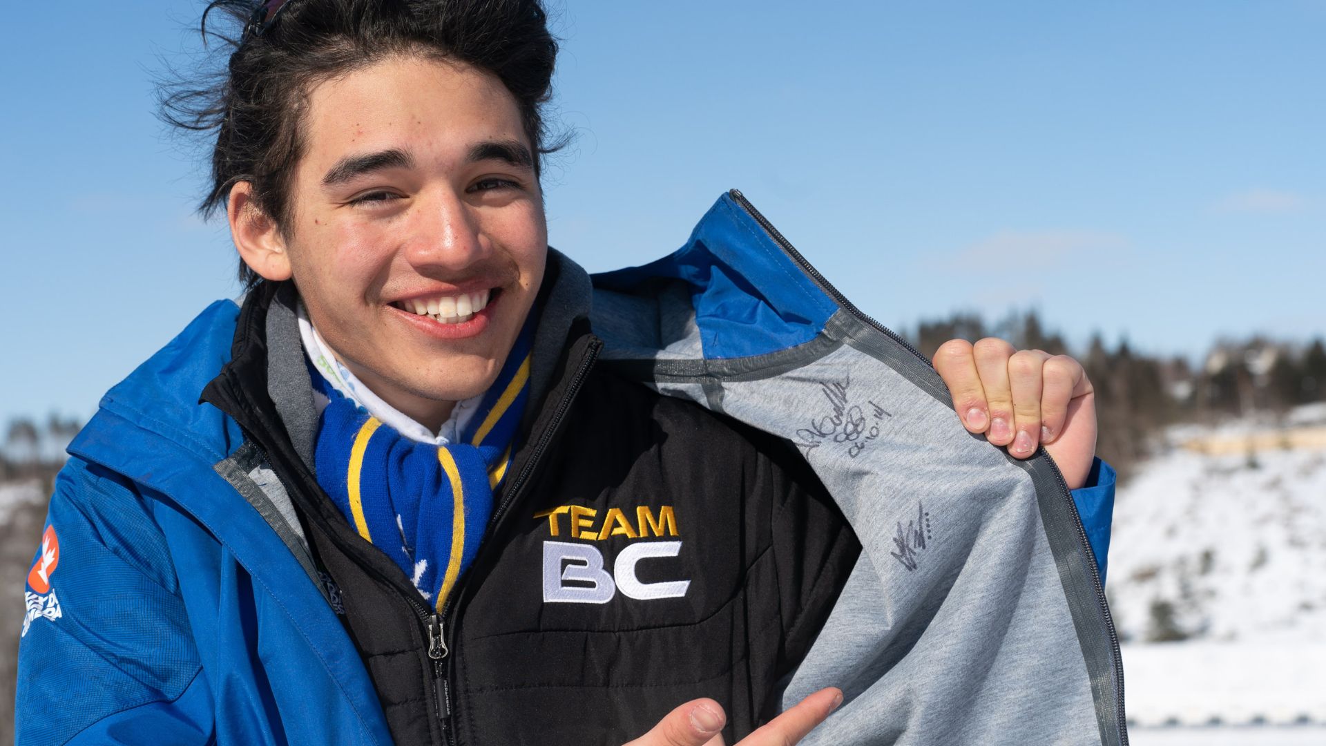 Solomonson poses with Team BC winter jacket.